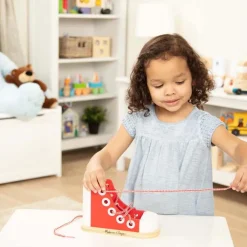 Hjælpemidler<Melissa & Doug Snørebåndsstøvle